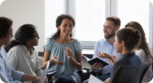 Health professionals sitting in a circle and talking